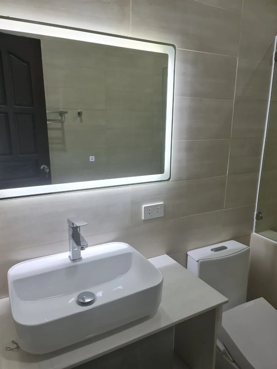 Installed bathroom vanity, basin and mirror