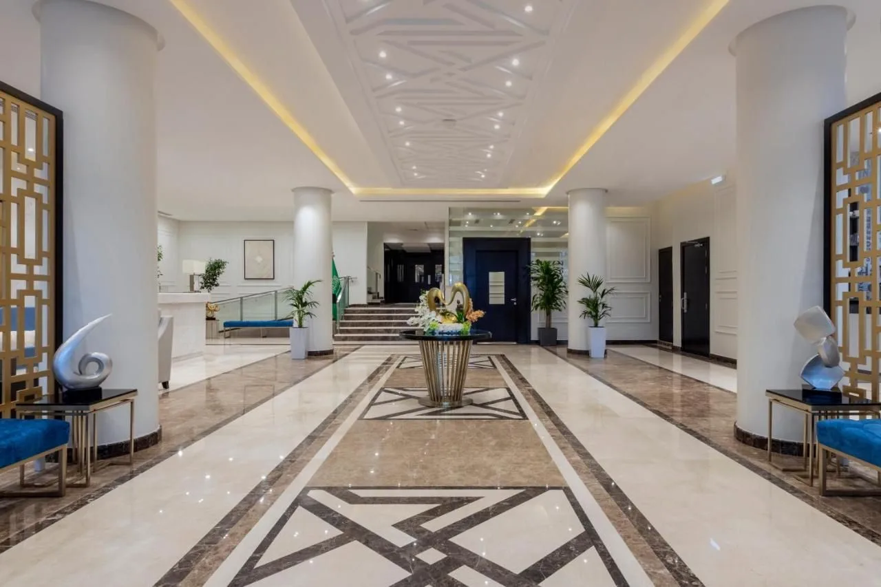 Finished hospitality lobby with seating, lighting and floor finishes