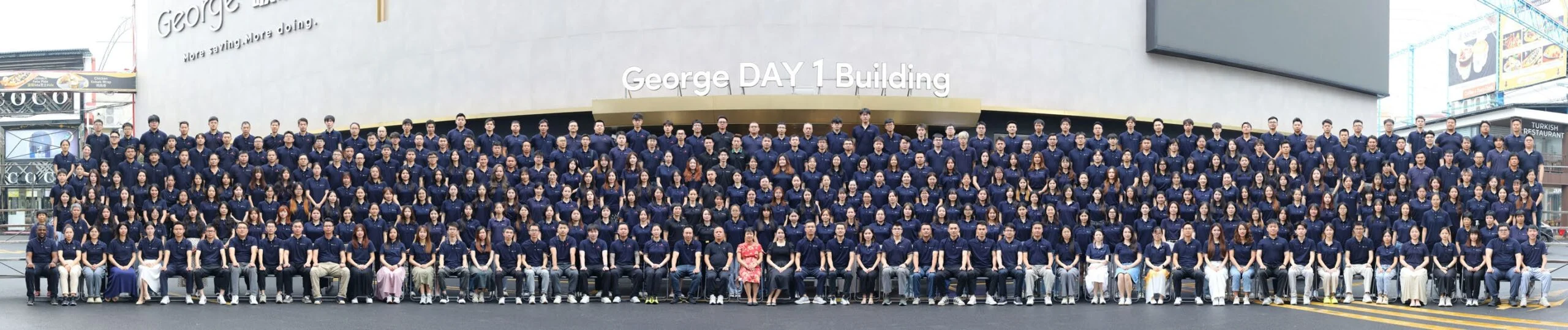 George Group China team members in front of George DAY 1 Building